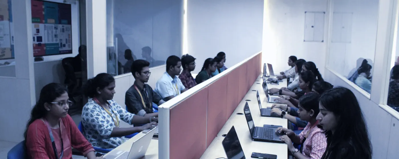 A wide view of the KaizenSpark lab with rows of workstations in use